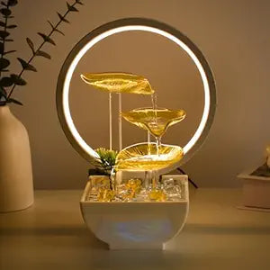 Decorative water fountain with LED lights on a table