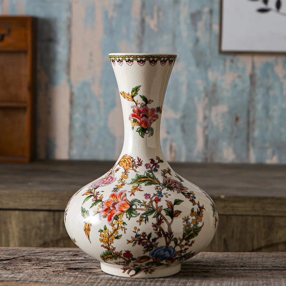 Floral ceramic decorative vase with artistic detailing for tabletop and shelf decor