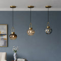 Modern glass pendant ceiling lights with smoked glass finish for contemporary interiors