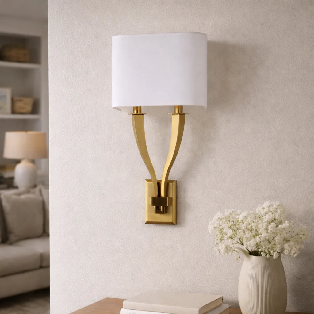 Modern gold wall sconce light with fabric shade for contemporary interiors